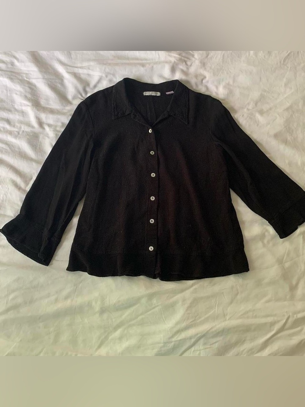 Vintage black button-up blouse with ruffled sleeves